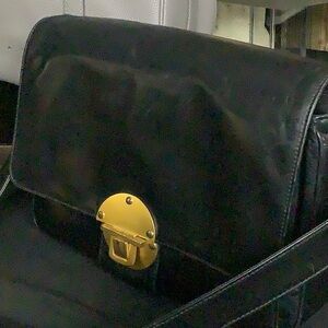 Elegant Black Crossbody Bag with Gold Accents